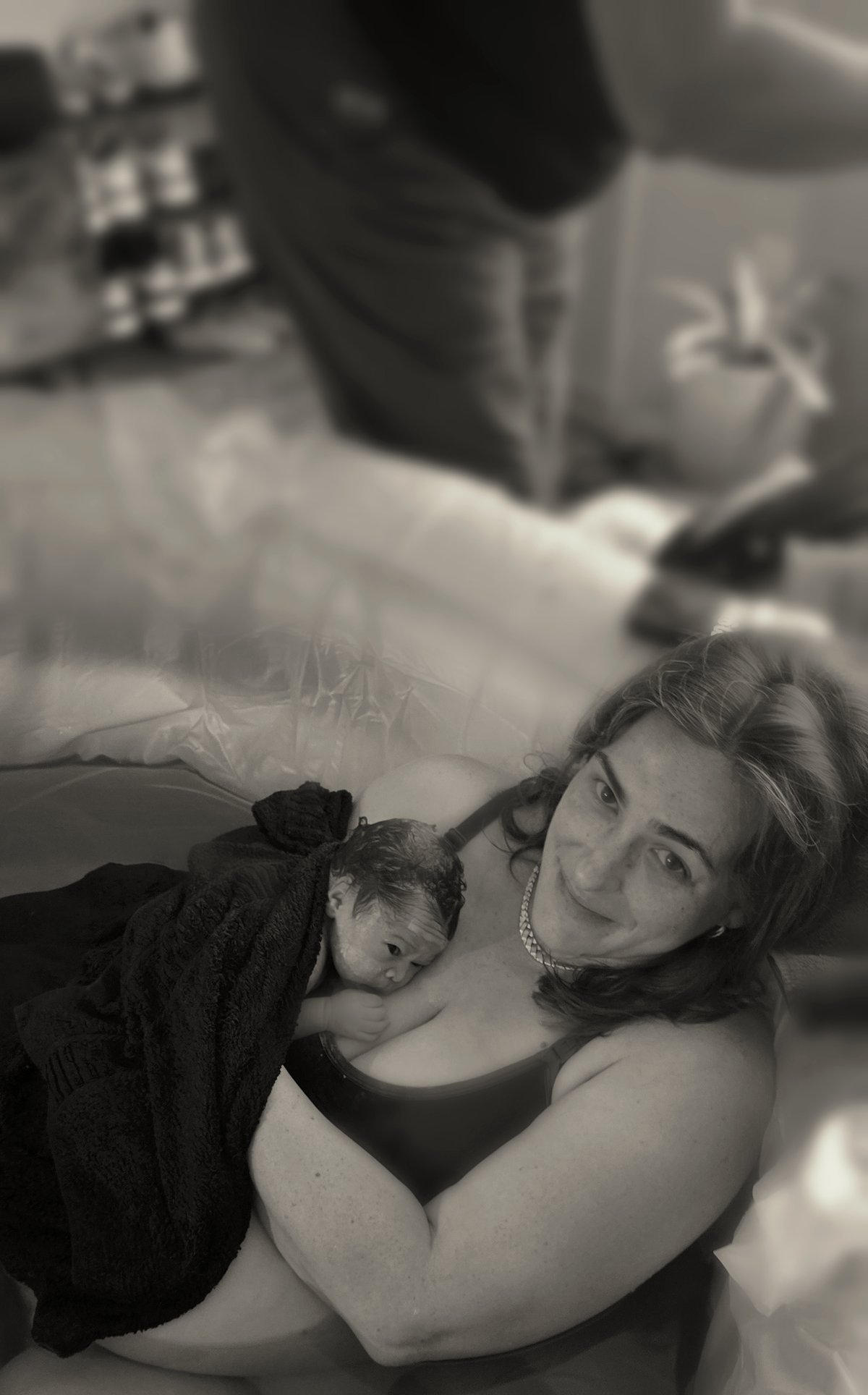 Christy holding her newborn moments after birth